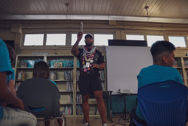 Joseph Dickson speaking to youth at a community event on Maui