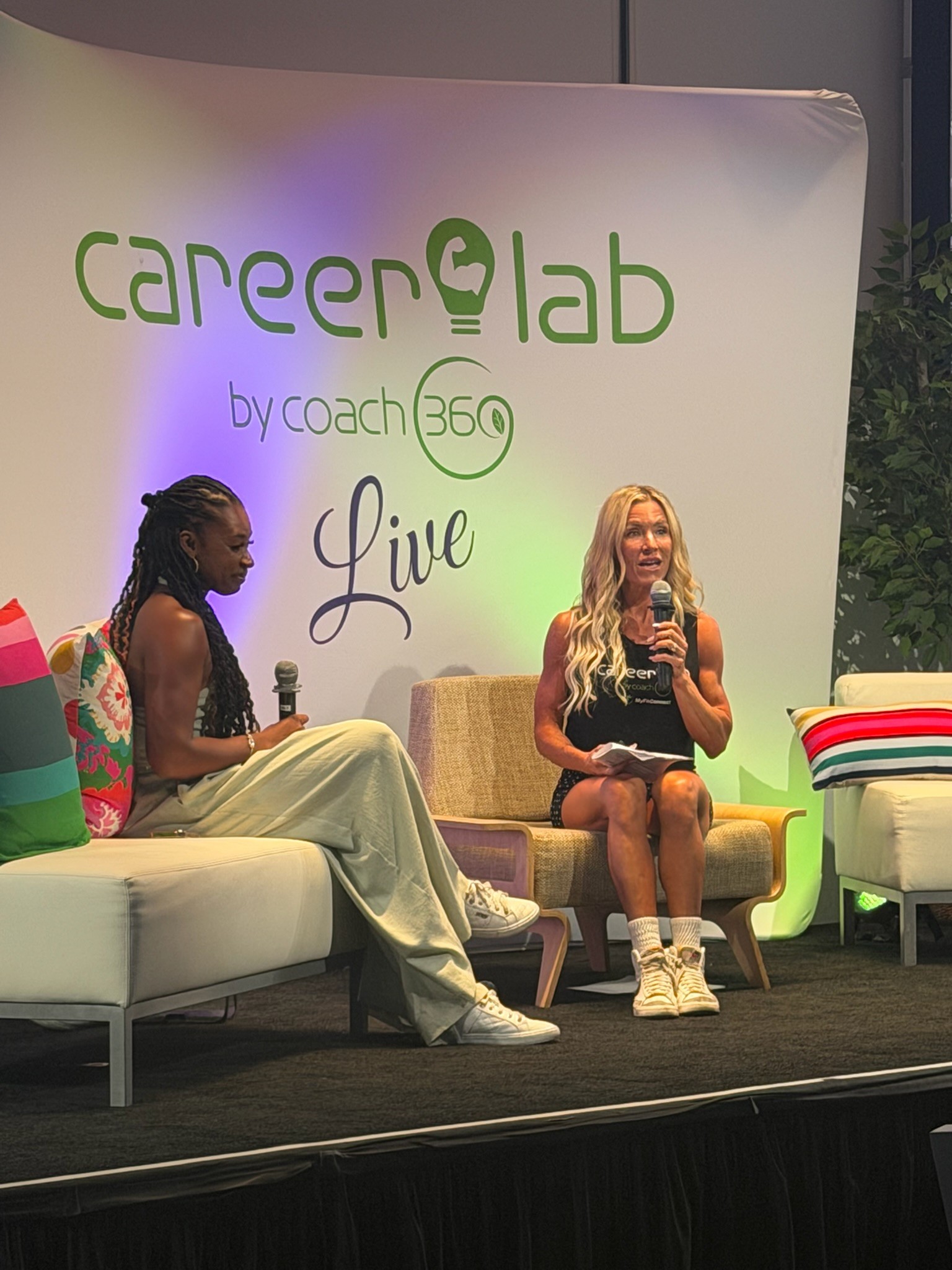 Two panelists in conversation on the Career Lab by Coach360 LIVE stage