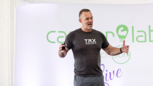Physique coach reviewing brand content strategy — beyond coaching brand business Career Lab 2026