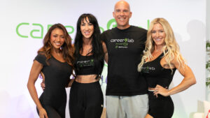 Fitness professionals networking and taking notes during a Career Lab by Coach360 breakout session in Las Vegas.