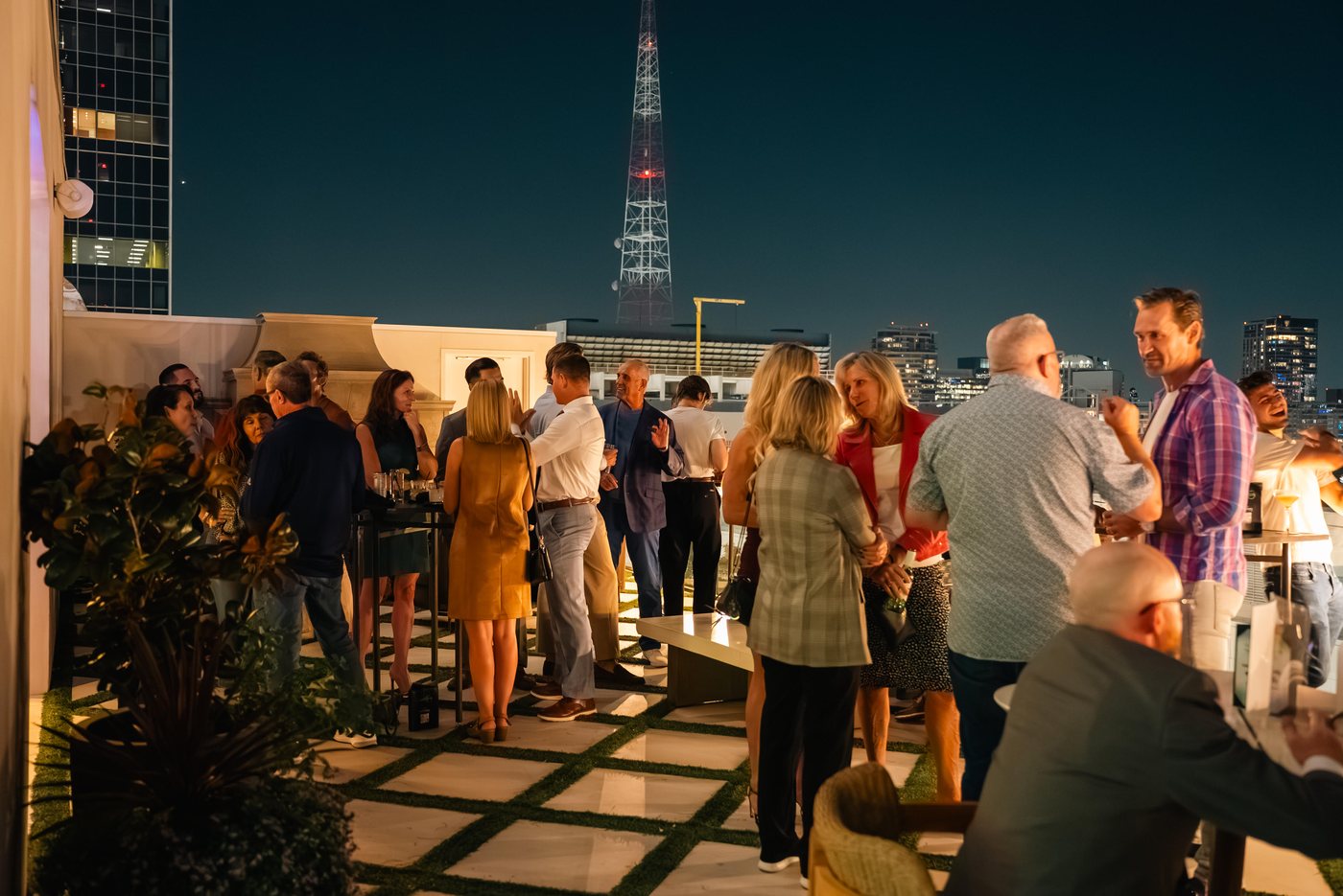 Guests mingling on a rooftop at last year's Operator's Table